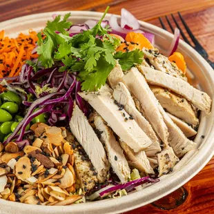 a chicken salad with carrots, edamado, and edamado