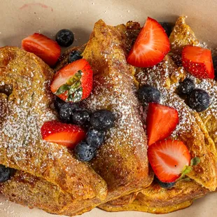 strawberries, blueberries, and powdered sugar