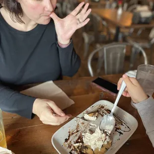 a woman and a child eating