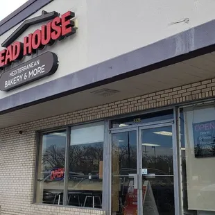 a white truck parked in front of the building