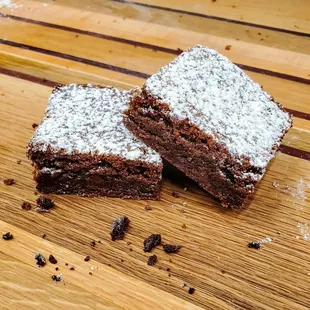 two brownies on a cutting board