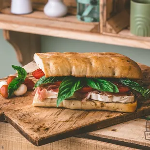 a sub sandwich on a cutting board