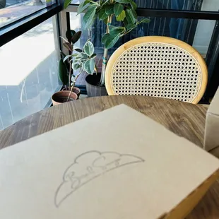 a box of pizza on a table