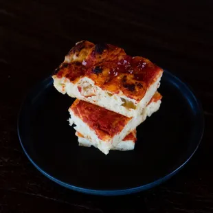 three slices of pizza on a plate