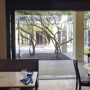 Collapsing doors open to the courtyard