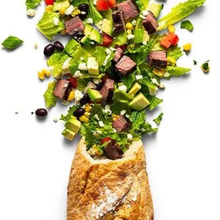 a salad in a bread bag