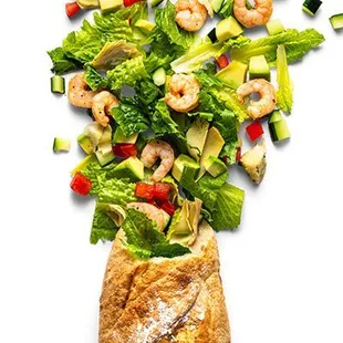 a salad with shrimp and lettuce