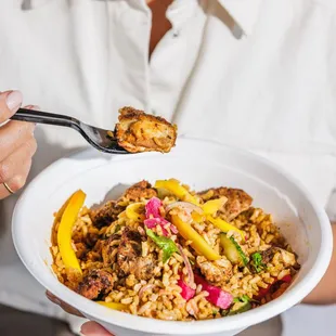 a woman holding a plate of food