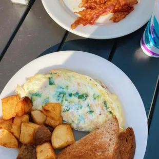 Egg White Spinach, Egg, and Cheese Omelette with Whole Wheat Toast and House Fries.