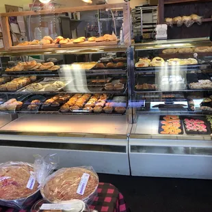 a man standing in front of a bakery