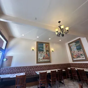 a dining area with tables and chairs