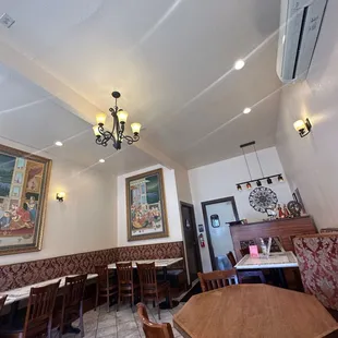 a dining area with tables and chairs
