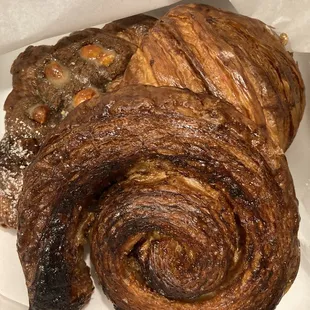 Assorted croissants- cookie butter and macadamia nut twice baked croissant, Taegu, spinach and manchego croissant, and pecan praline snail