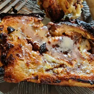 Orange brioche toasted in the oven with honey butter drizzle!