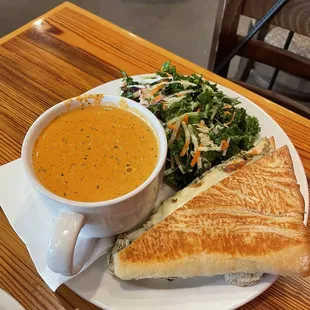 Half sandwich, Kale Salad, and Tomato Basil Bisque Soup