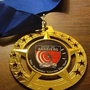A medal from the Mike Hernandez Veterans Day Shoot (2022)