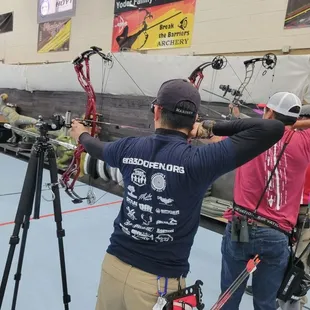 Blind Archer shooting alongside able bodied archers