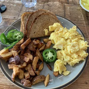 Eggs, toast, potatoes, jalapeños