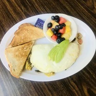 dine-in breakers' omelet with sourdough toast and fruit