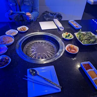 a table with various plates of food on it