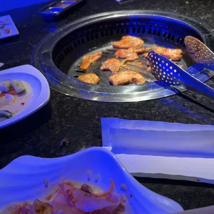 a grill with a variety of foods on it