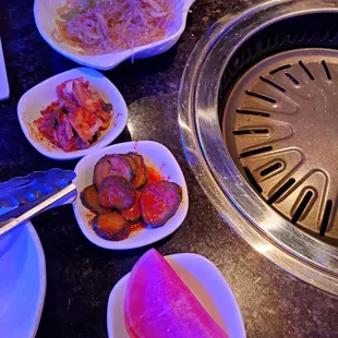 a variety of dishes of food on a table
