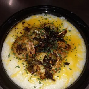 a bowl of grits and shrimp