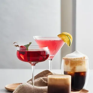 two cocktails and a cup of coffee