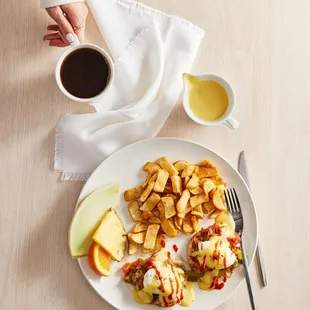 a plate of food and a cup of coffee