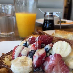 This is the fresh squeezed orange juice and I got the Firestone with French toast covered in raspberry, banana, blueberry and strawberry.