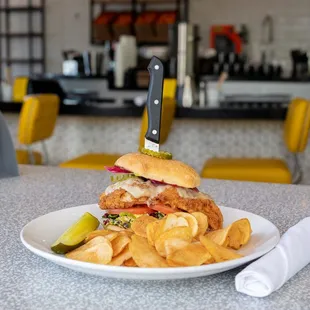 Fried chicken sandwich with chips