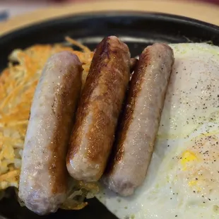 The big breakfast with perfectly cooked over medium eggs, sausage links, and hashbrowns. Perfect!