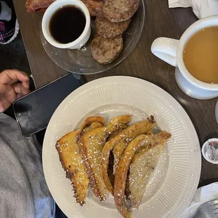 a plate of french toast and a cup of coffee