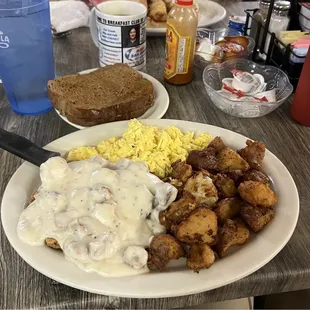 Country fried steak, eggs, seasoned home fries, rye toast, and a coffee