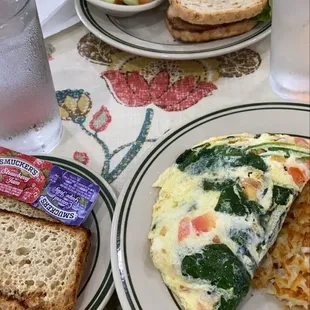 a plate of eggs, toast, and fruit