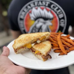 a grilled cheese sandwich and sweet potato fries