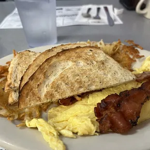 bacon, eggs, hash browns and toast