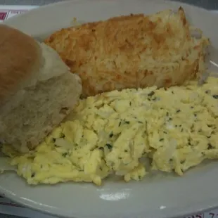 Creamy scrambled eggs, hash browns and a biscuit