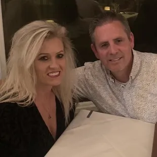 a man and a woman sitting at a table