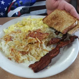 bacon, eggs, hash browns and toast