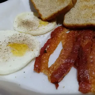 bacon, eggs, and toast on a plate