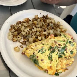 BYO omelet with bacon, tomato, cheddar and spinach with a side of HOUSE HASH