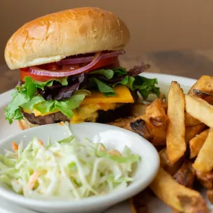 a hamburger, fries, coleslaw and coleslaw