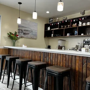 a bar with four stools