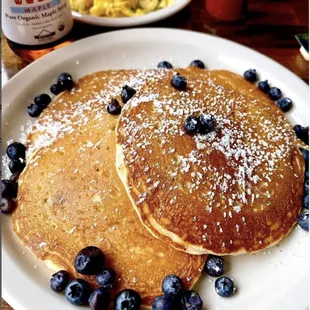 a plate of pancakes with blueberries