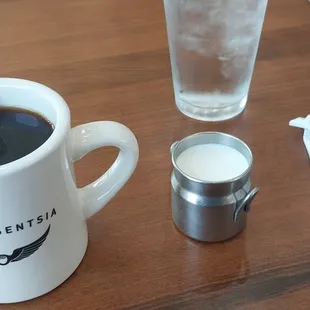 a cup of coffee and a shot of water