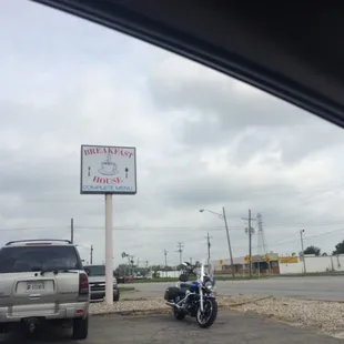 a motorcycle parked in front of a restaurant