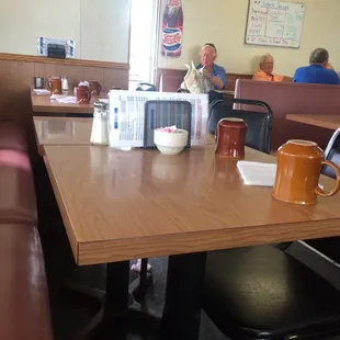 people sitting at a table in a restaurant