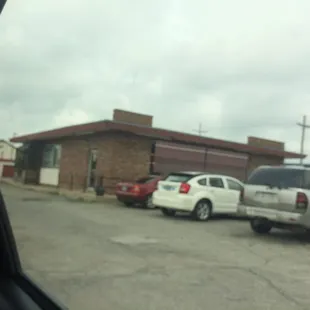 two cars parked in a parking lot