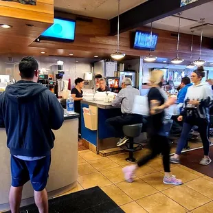 Front counter, customers and staff.